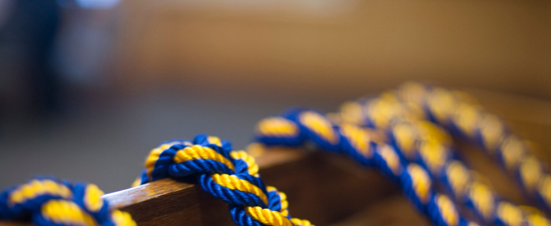 Blue and gold rope strung over a podium.