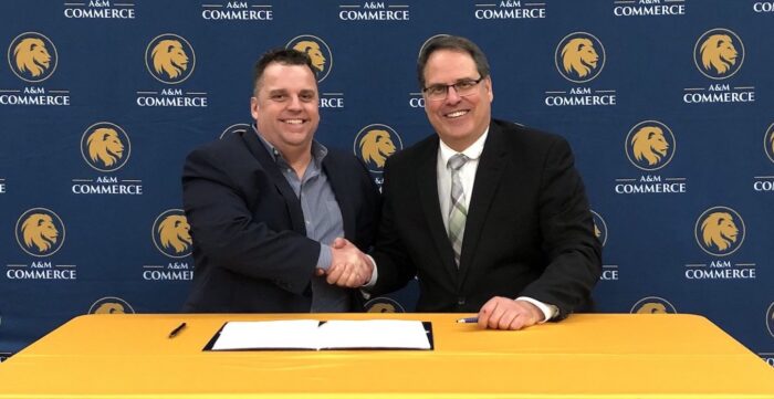 Dr.Marty Crawford and Dr.Mark Rudin sign a memorandum of understanding to create the Tyler ISD Pledge.