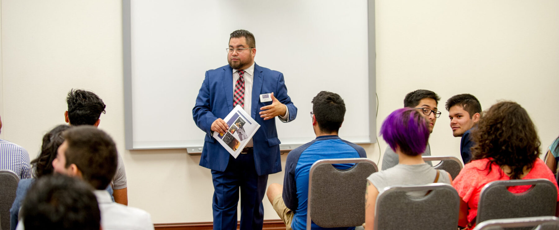 Dr. Fred Fuentes giving a presentation.