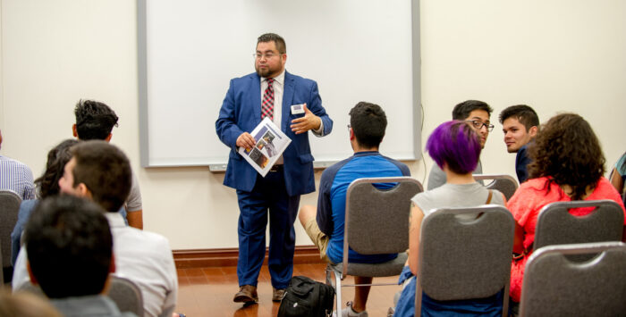 Dr. Fred Fuentes giving a presentation.