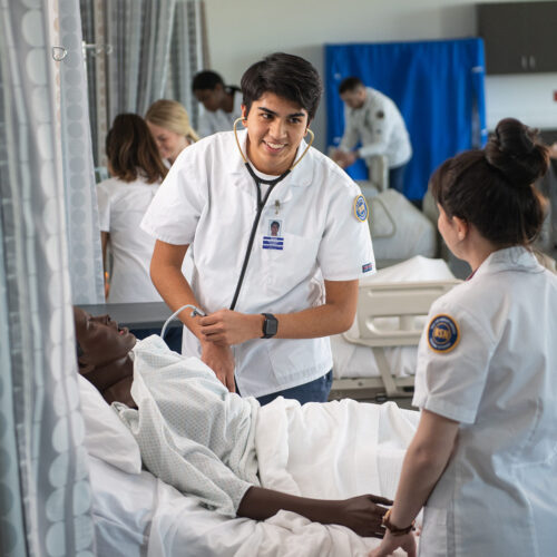 Two nursing students in the simulation lab.