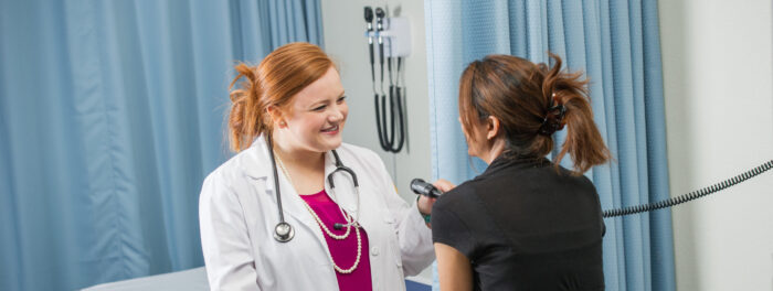 Health provider examining a patient.