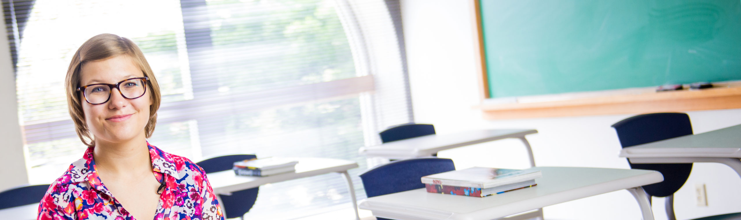 Teacher sitting in a classroom.