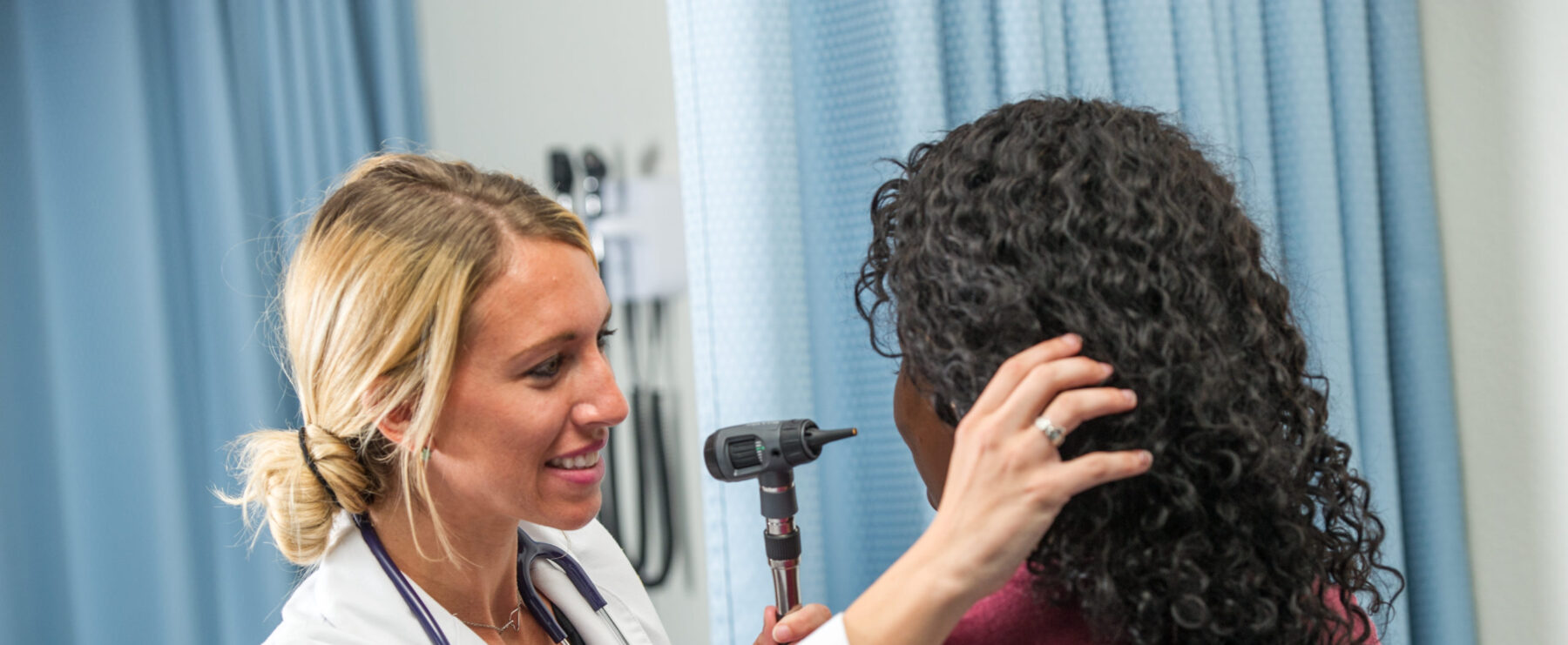 Nursing students evaluating a patient.