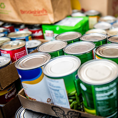 Cans of food delivered to a food drive.