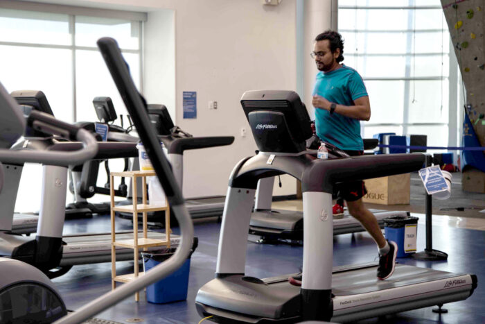 A male member running on the treadmill.