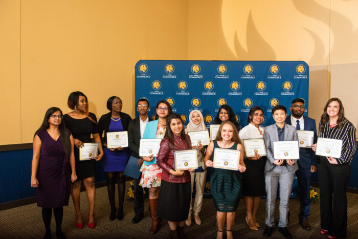 Group photo of students from TAMUC College of Business holding their certificates.