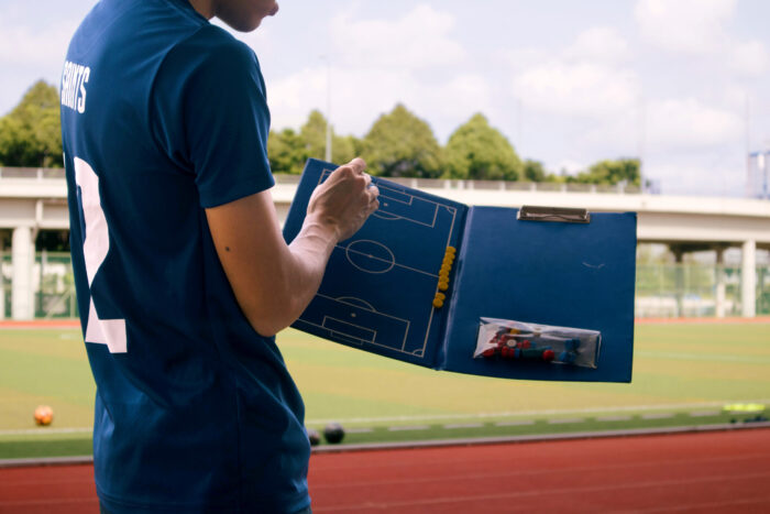 Student gaining hands-on experience as a soccer coach.