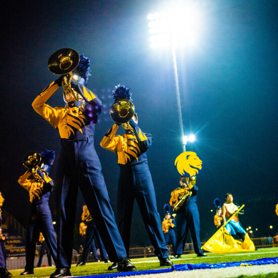 Marching band playing.