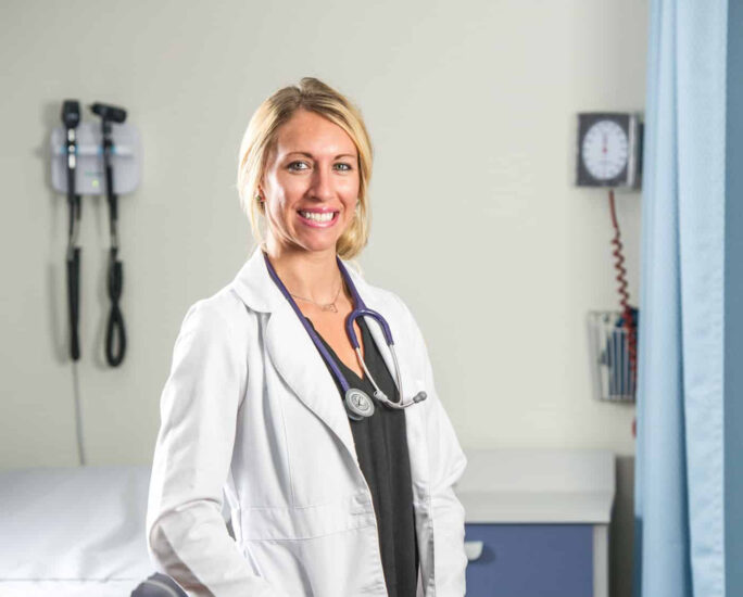 A female nurse student smiling.