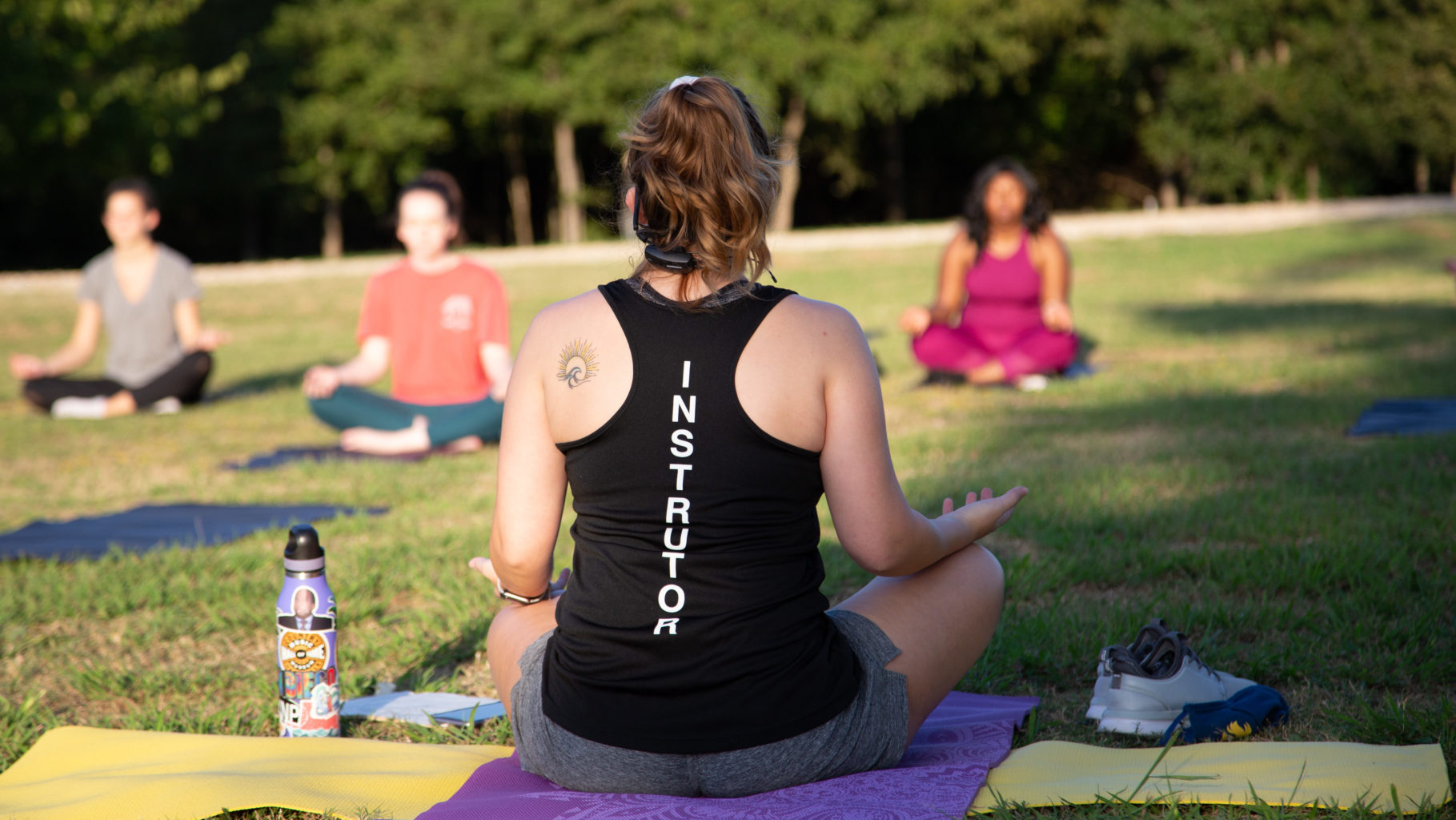 A Campus Recreation instructor leading a yoga session.