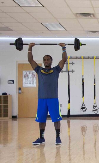 TAMUC student working out in the Activity Room at the Morris Recreation Center.