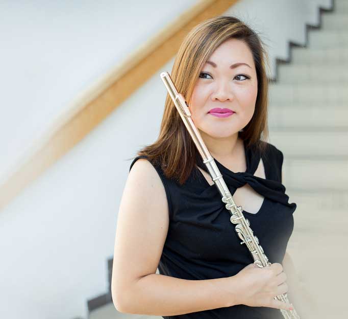 A female flute professor.