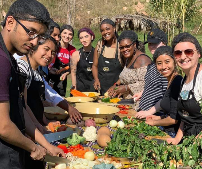 group of student cooking outside during an event.