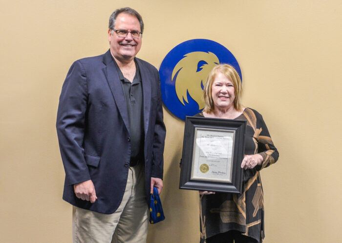 Alicia Currin receives am Emeritus honor from the A&M System, presented by Dr. Mark Rudin