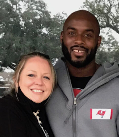 A woman and a man smiling for a picture.