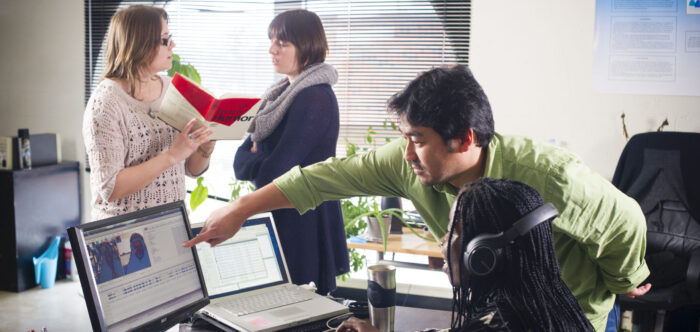 Professor working with student in the linguistic lab.