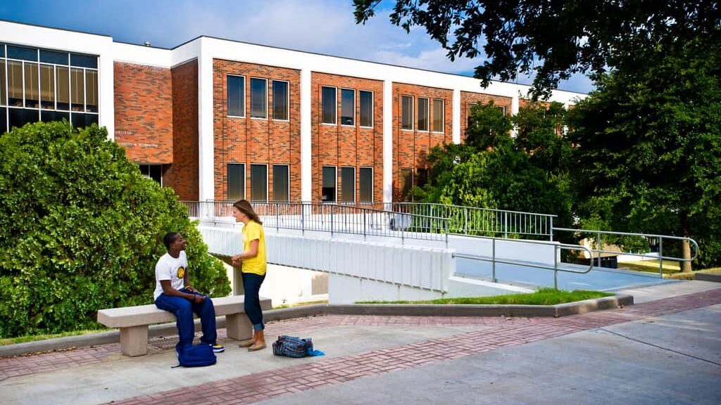 students interacting background 'McDowell Administration Building'.