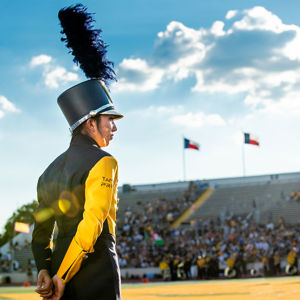 Band member on the football field.