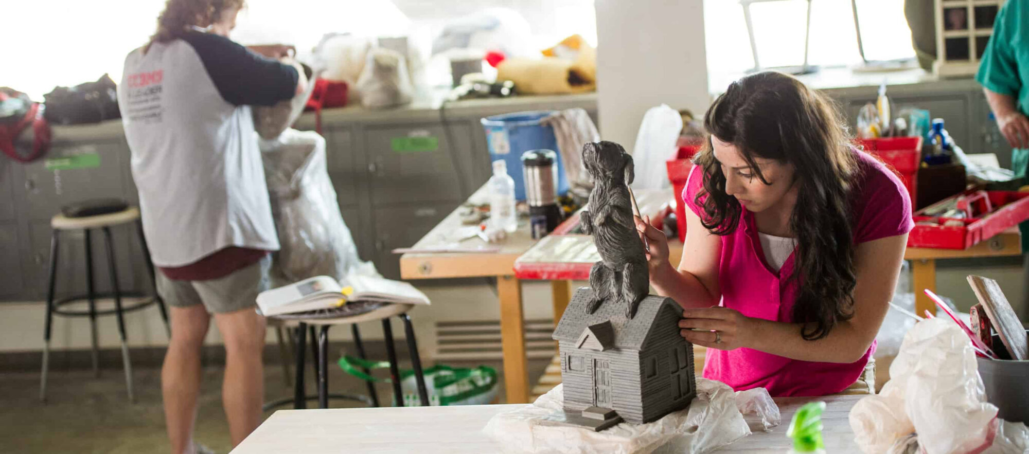 TAMUC student creating an art piece in the art lab.