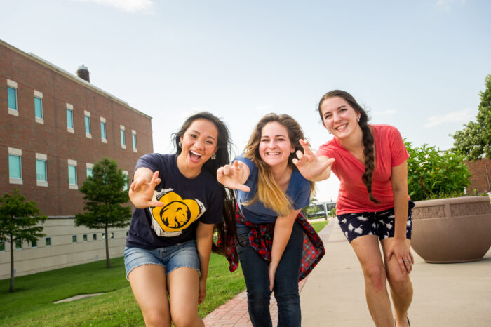 Three students outside of the Rayburn Student Center.