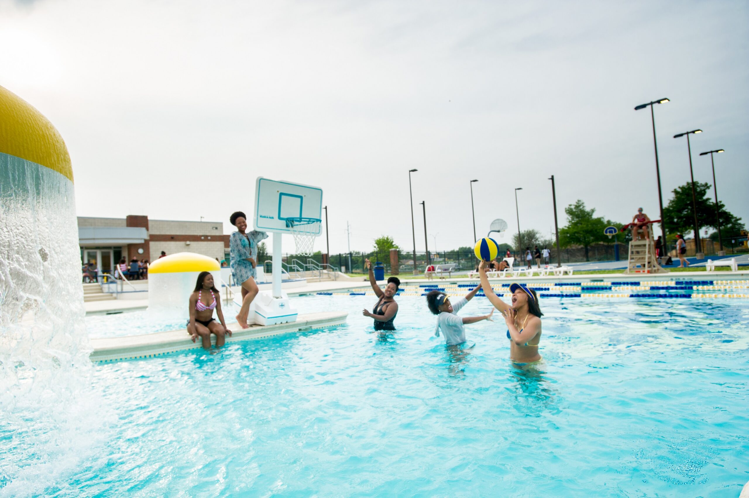 Students playing in water at the pool at the MRC