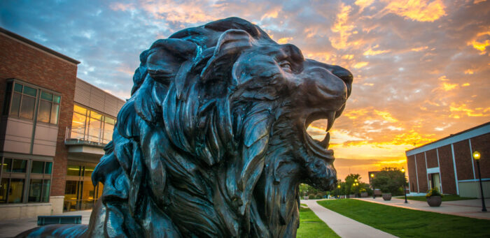 TAMUC lion statue at dusk