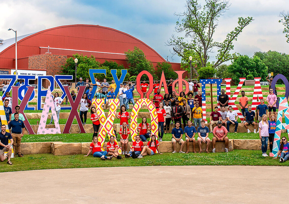 Many greek organization showing off their letters.