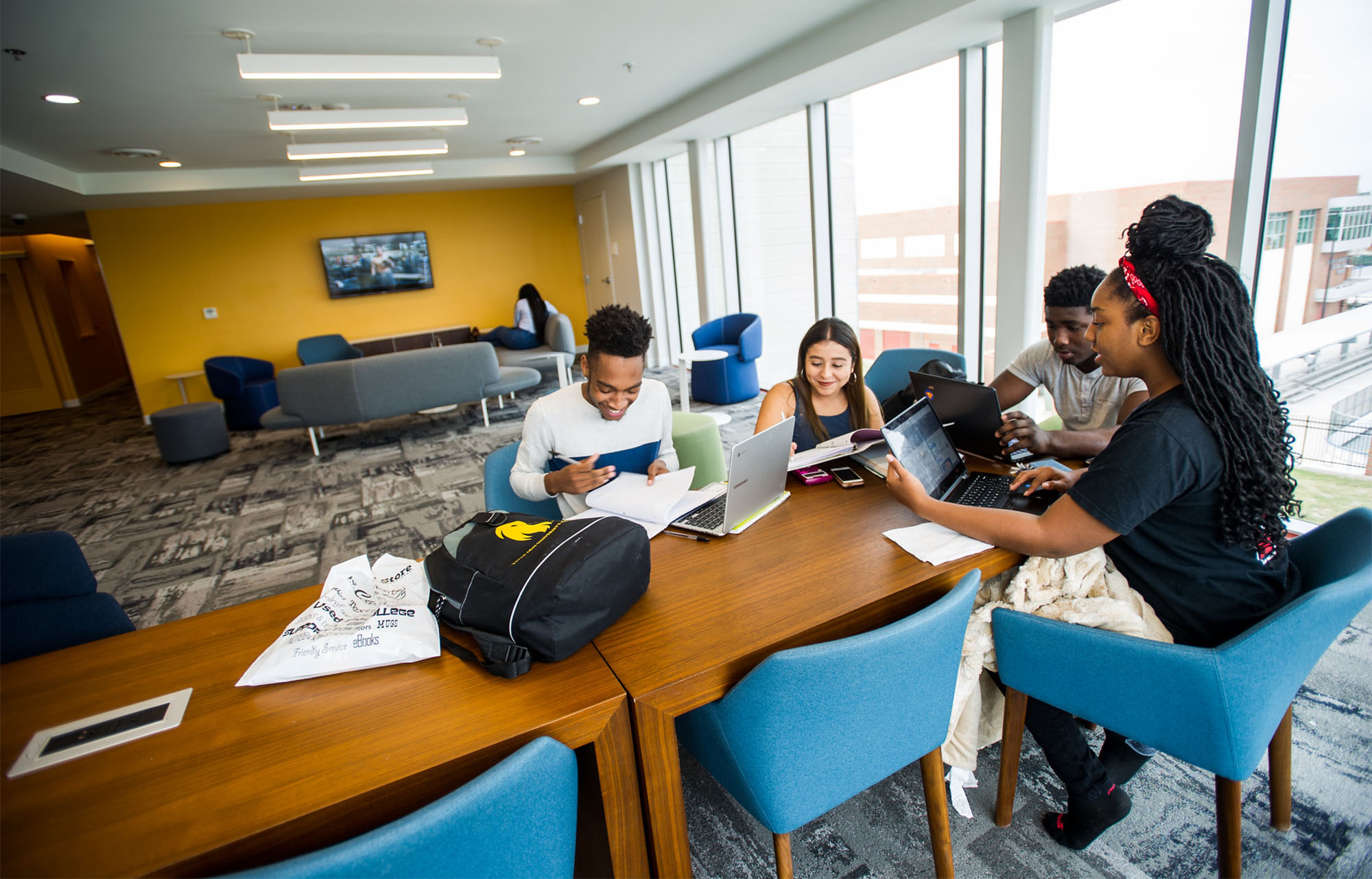 A group of students completing an assignment together.