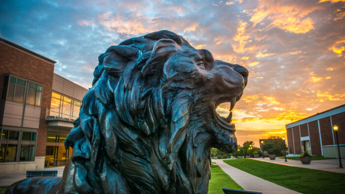 TAMUC lion statue at dusk