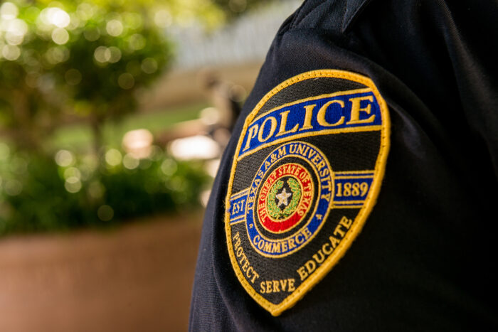 University police badge on officer uniform.