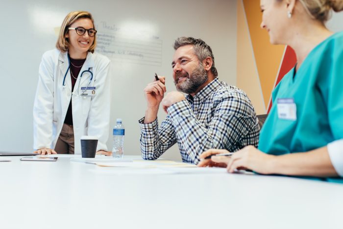 Medical team interacting at a meeting in boardroom.