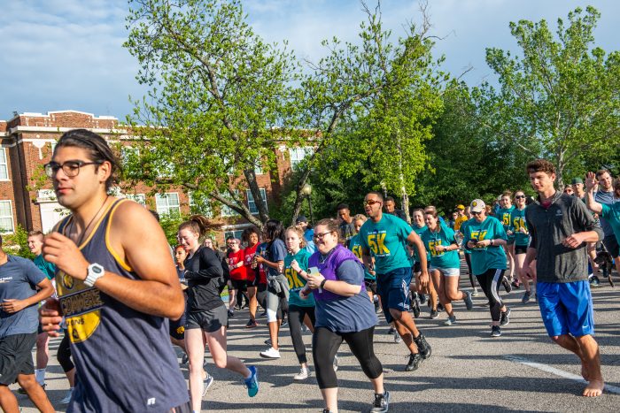 Individuals doing a 5k run throughout the campus.