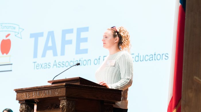 TAFE chapter president Caitlynn Moniz address conference crowd