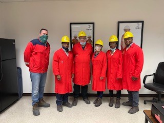 Six individuals in a group photo at hydro aluminum