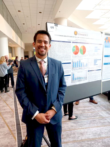 TAMUC student Omar Ramirez with his winning poster design