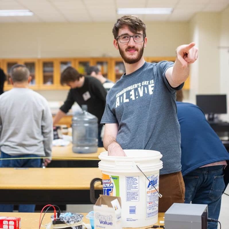 Student preforming lab experiment.