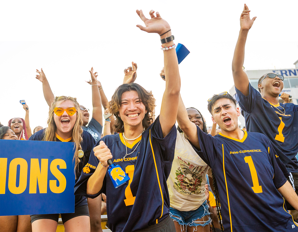 Spirited students cheering at the football stadium