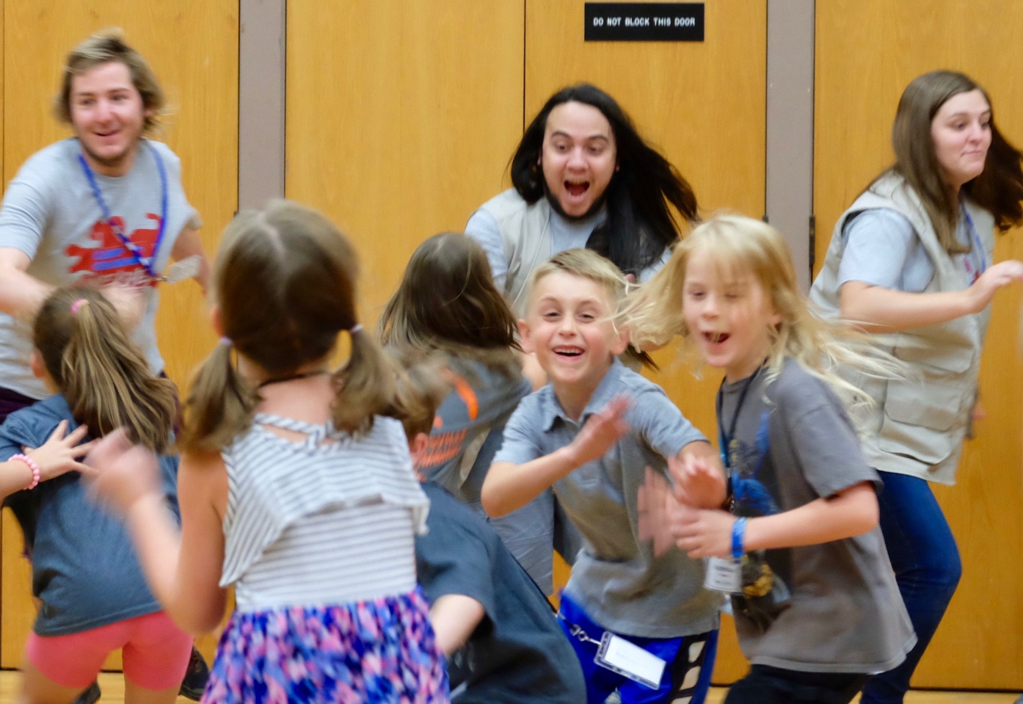 Students and instructors participating in a physically active game.