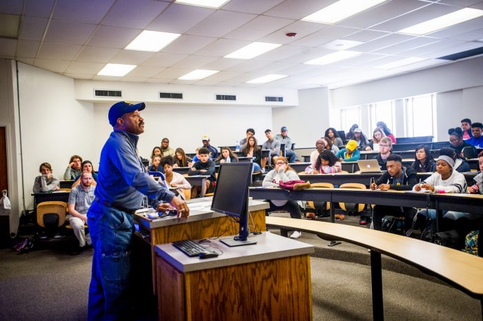 Dr. Henndicks in a classroom teaching students.