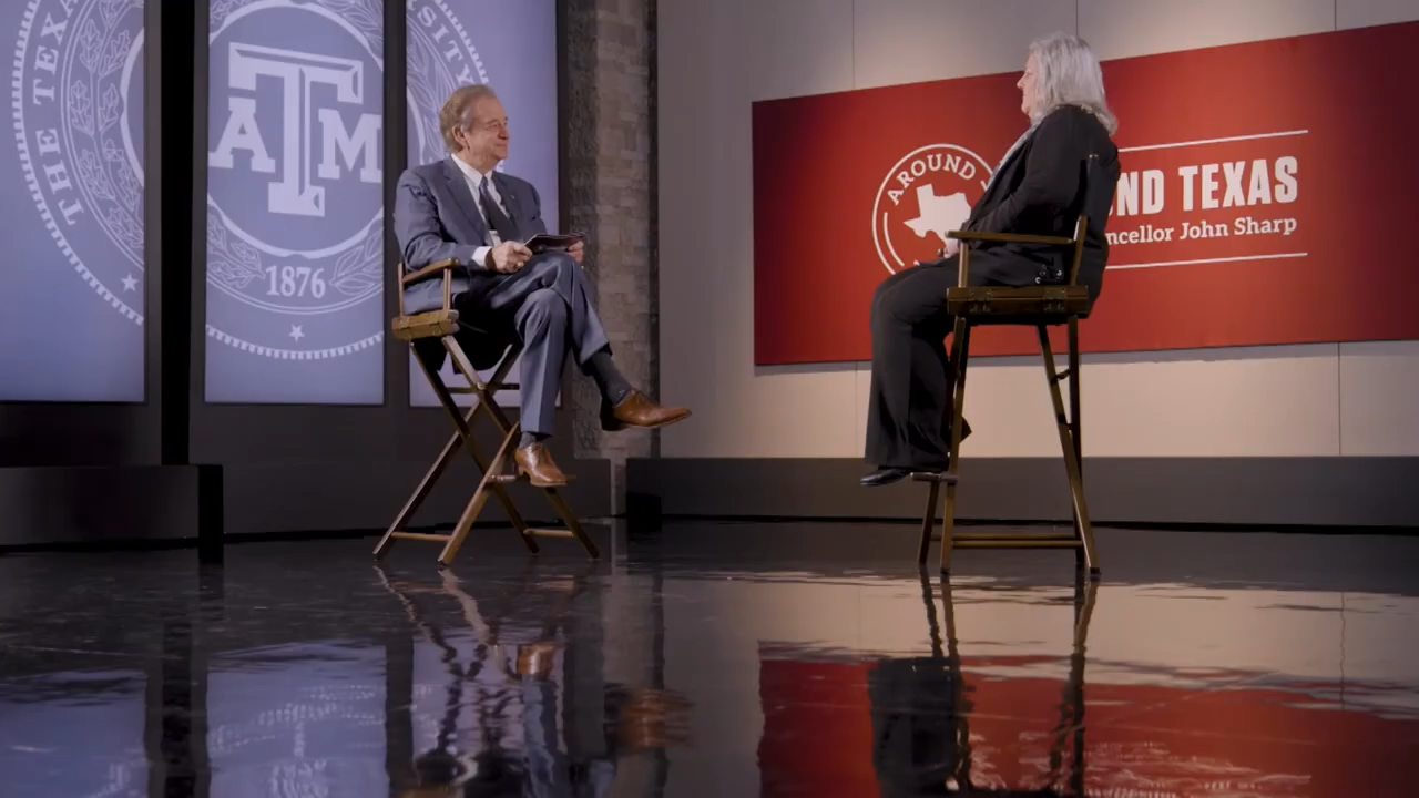 Host and interviewee sit in director chairs