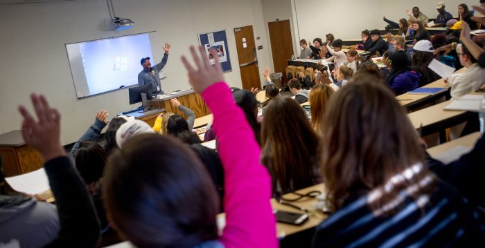 A professor interacts with the classroom