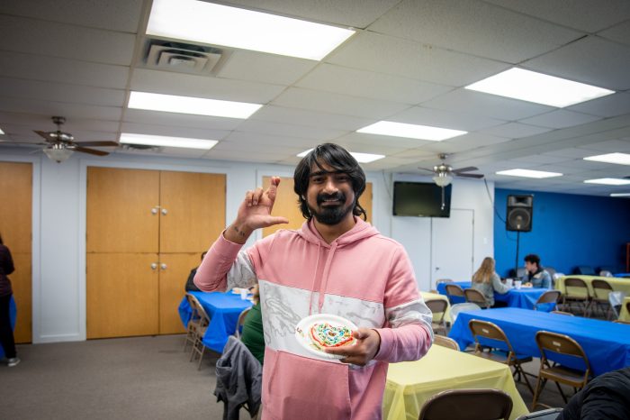 MANIKANTA VEMPATI displaying the leo hand sign.