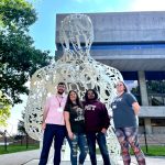Four A&M-Commerce students in front of MIT art installation