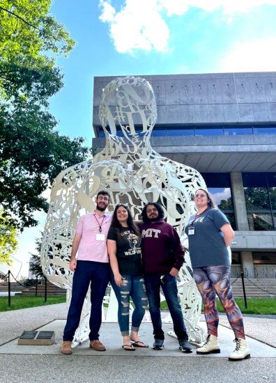 Four A&M-Commerce students in front of MIT art installation