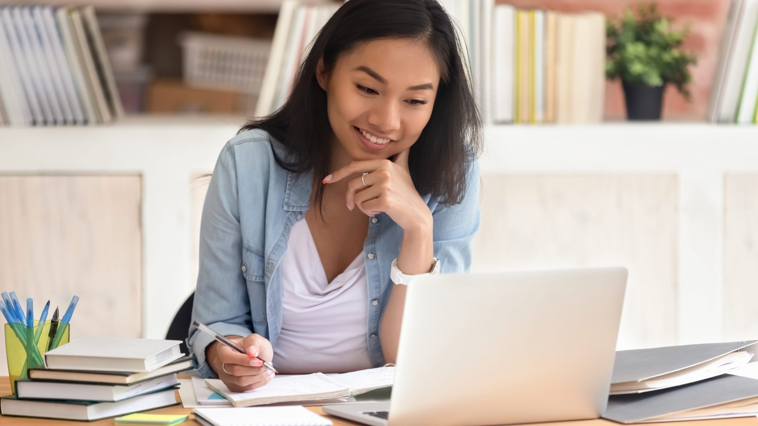 Student completing her assignments in front of a computer