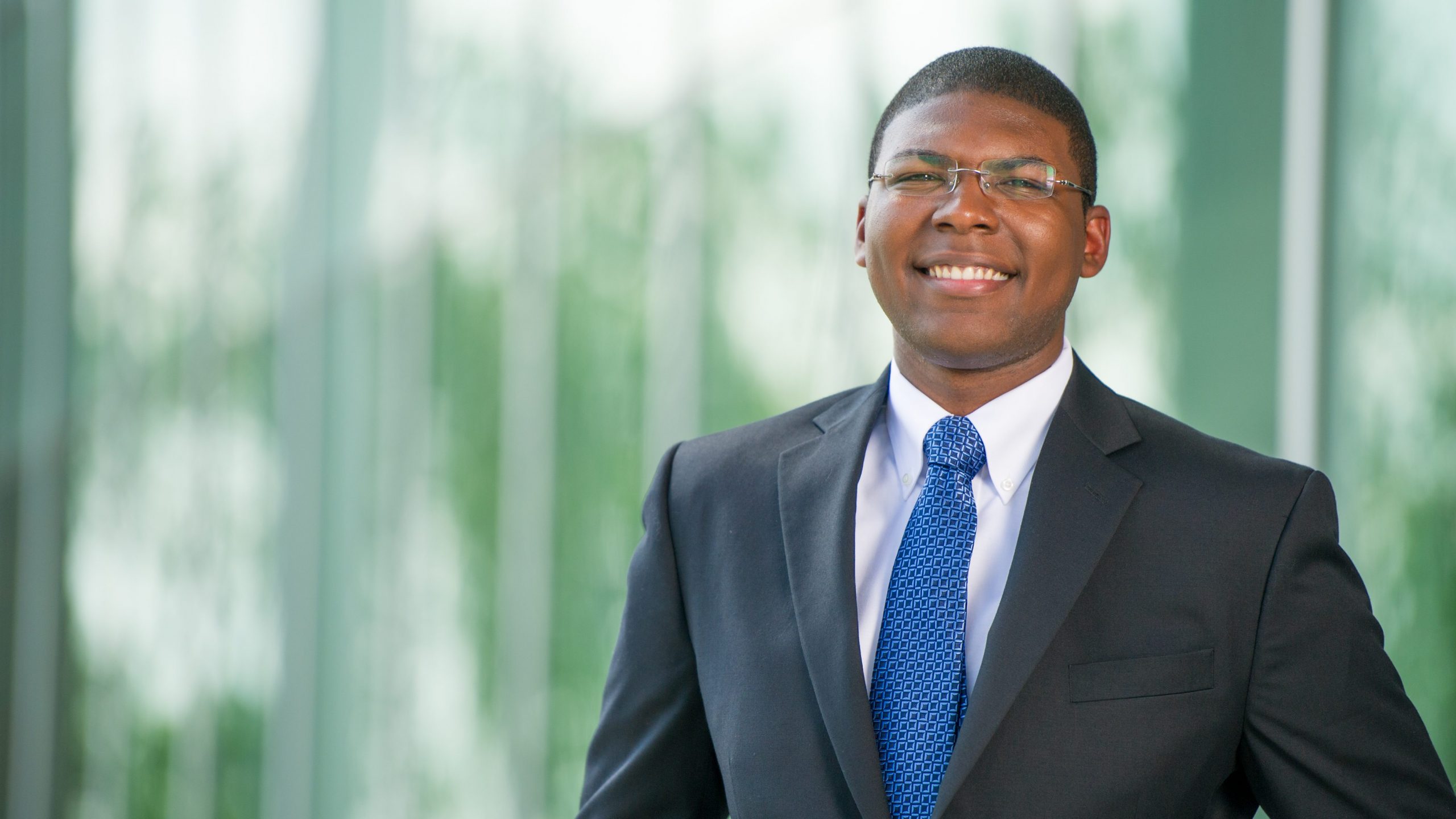 A male student smiling to the camera