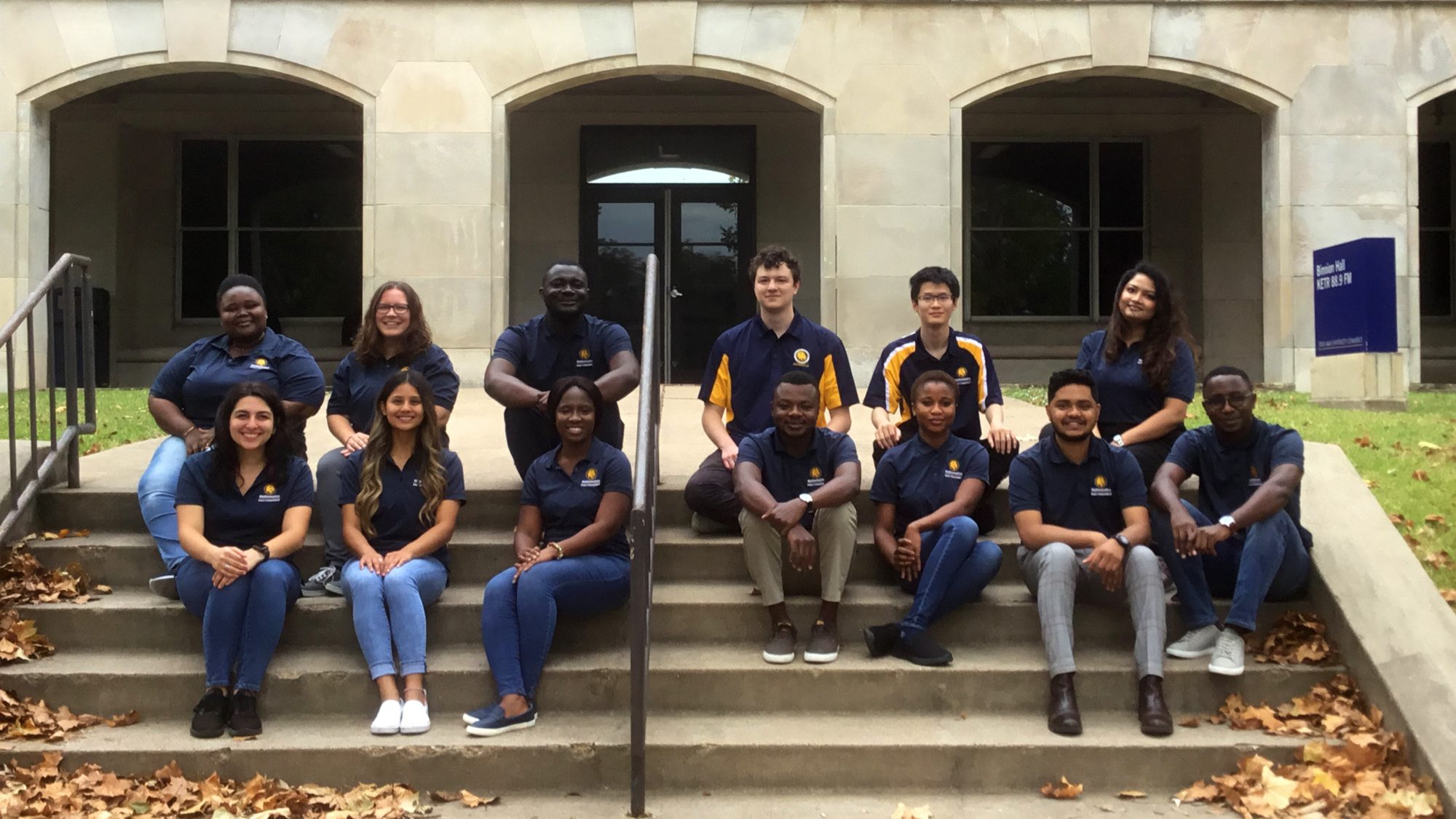 A group of students in front of Binnion Hall. 