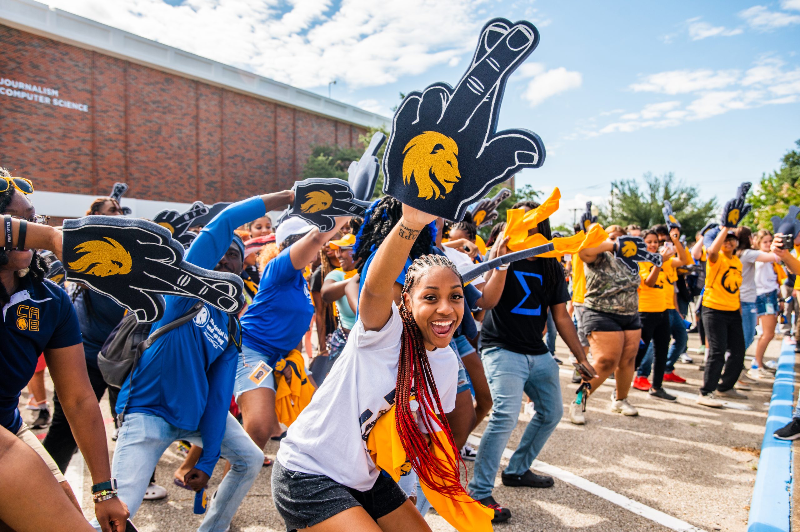 A group of students cheering for an event.