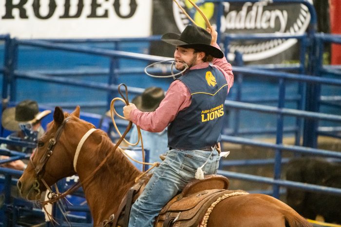 A male leo student on a horse. 